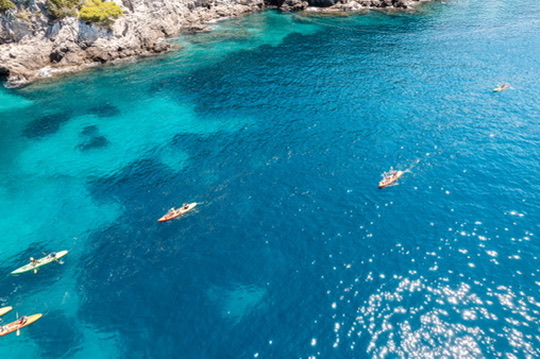 Sea kayaking in crystal clear waters near Dubrovnik